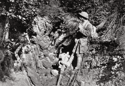 American soldiers rest in trench