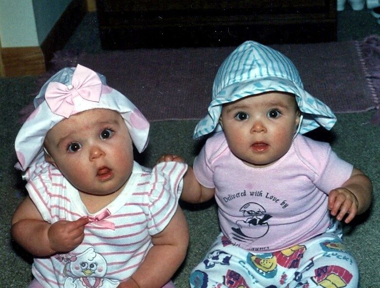 two babies wearing silly hats