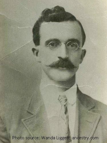 old photo of man from the 20s with glasses