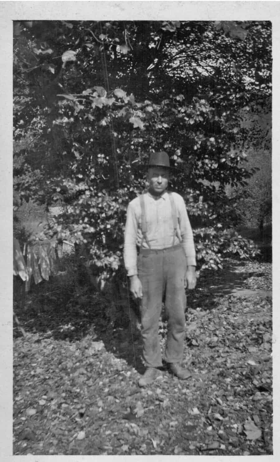 vintage picture of man with galluses and a hat