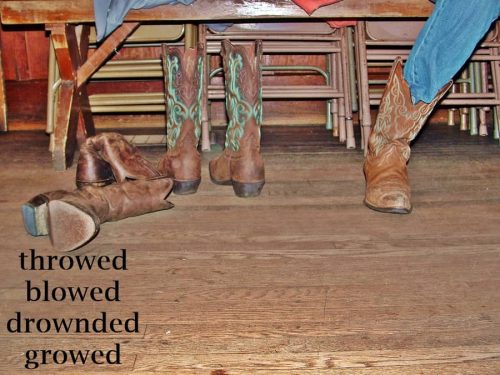 wood floor with boots laying on it