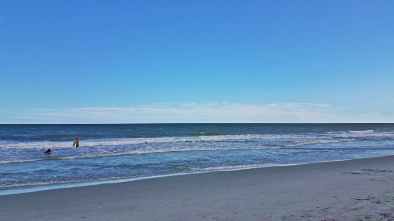 ocean view with two girls in the water