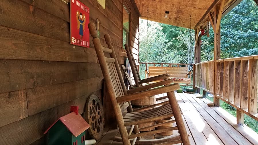 rocking chairs and swing on porch