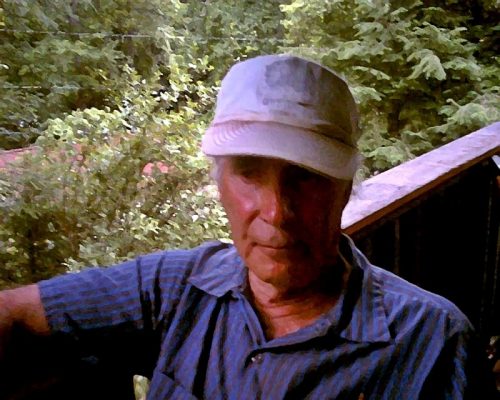 man sitting on porch