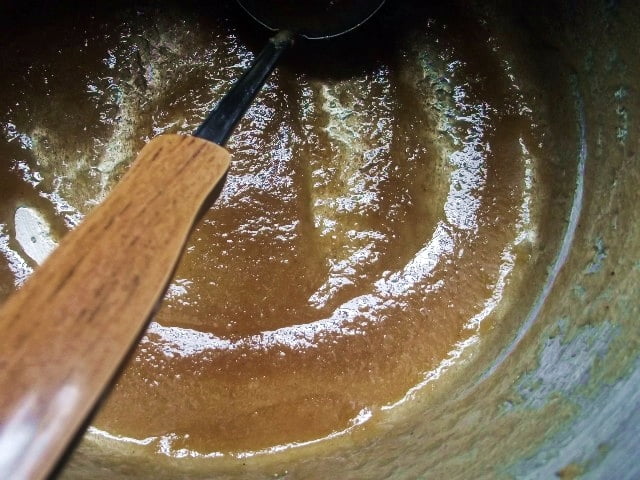 pot full of apple butter with ladle