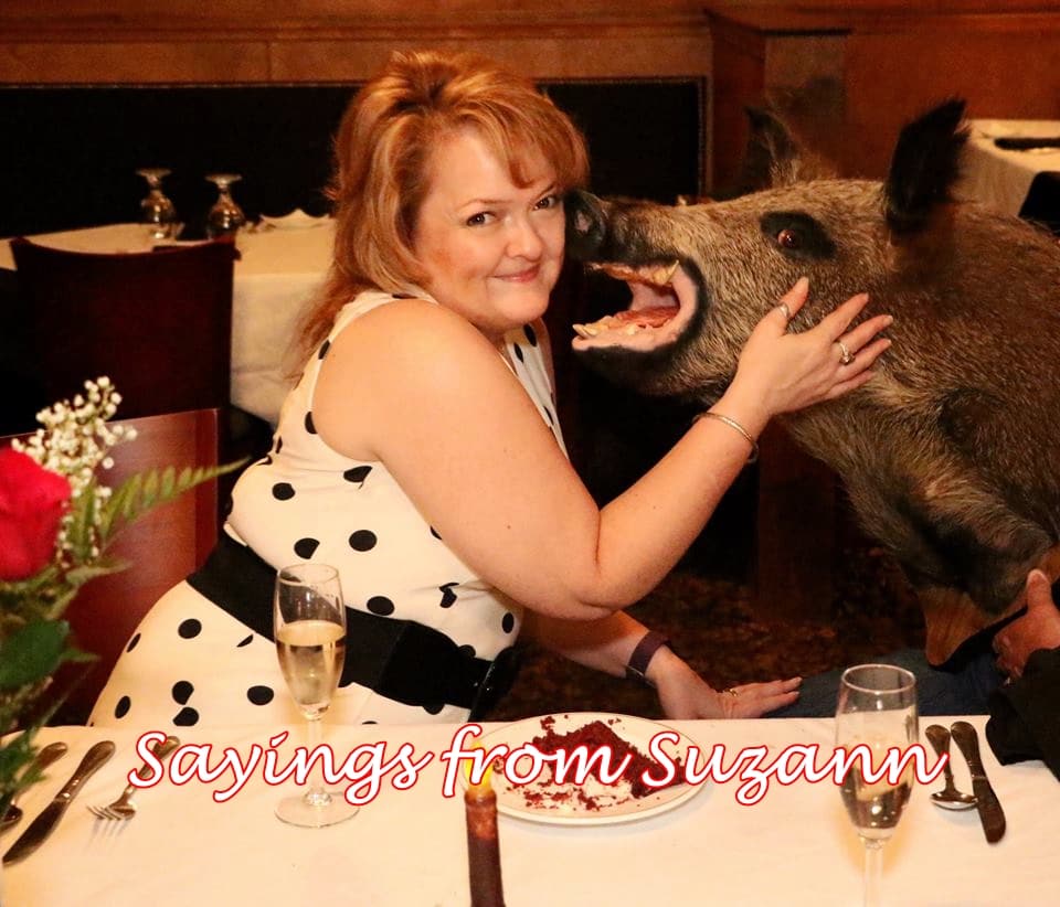 lady petting a stuffed boar