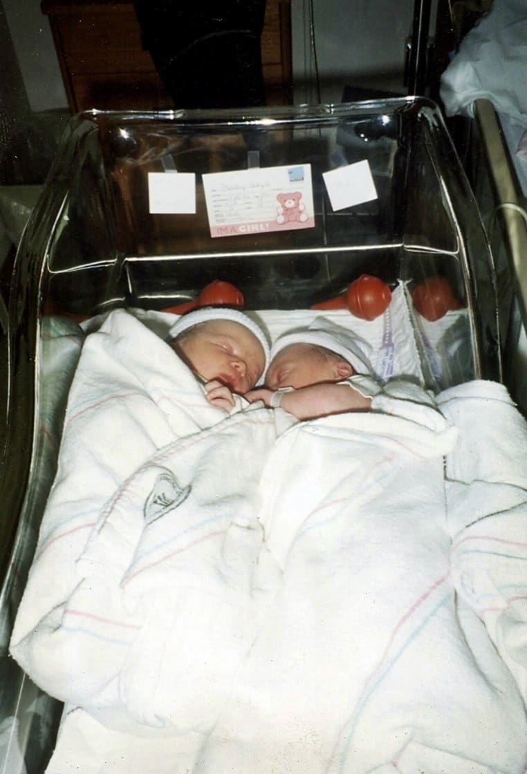 twins babies in bassinet 