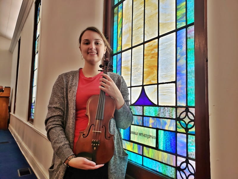 girl holding fiddle