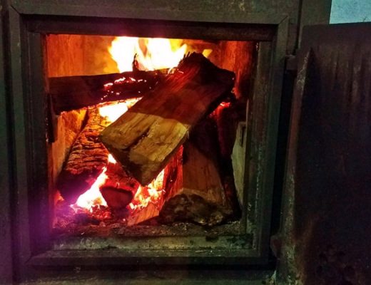 burning logs in a woodstove
