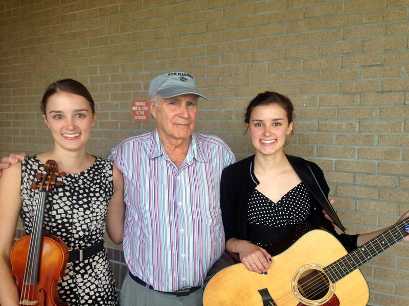 girls with their grandfather