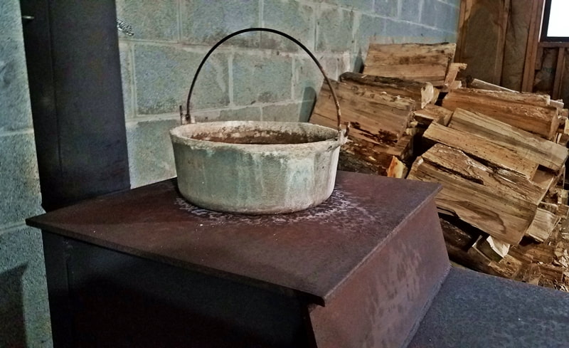 boiling pot of water on woodstove