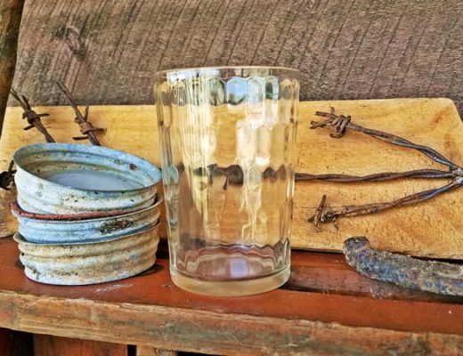 snuff glass sitting on wooden crate