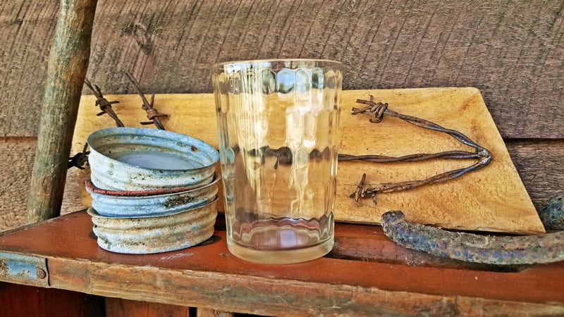 snuff glass sitting on wooden crate