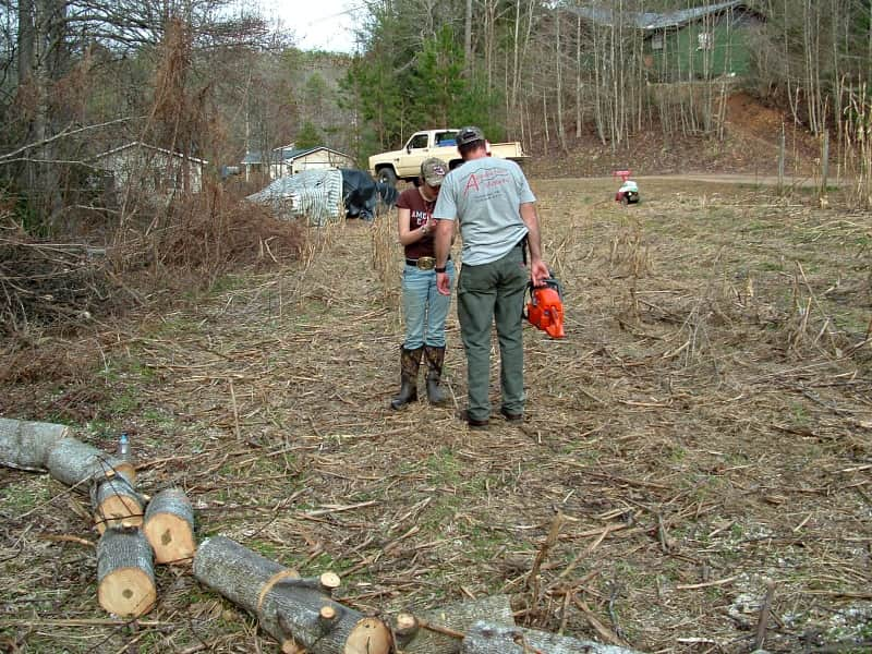 corie and matt working in garden