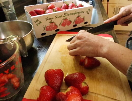 cutting up strawberries