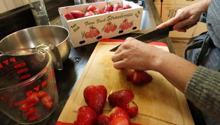 cutting up strawberries