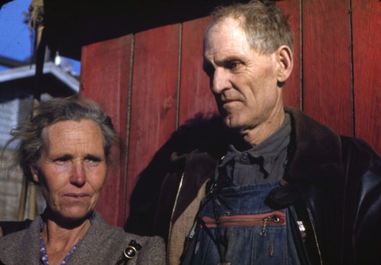 Man and woman by barn