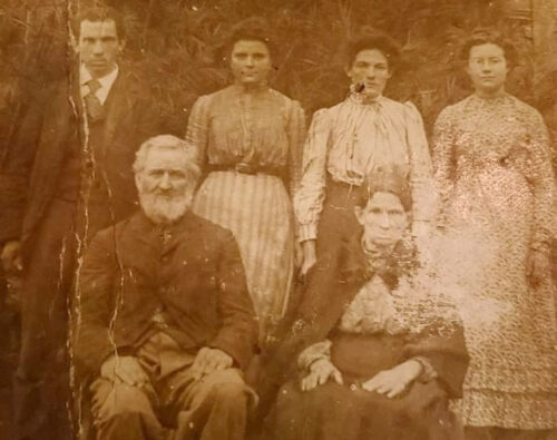 very old photo of men and women