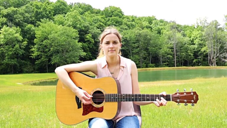 Chatter with guitar by pond