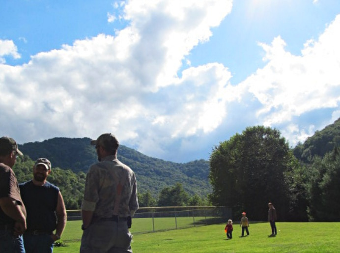 mountain field with people