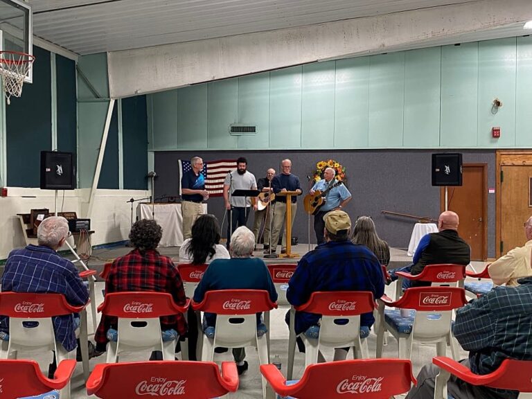 men on stage singing
