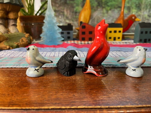 four bird figurines