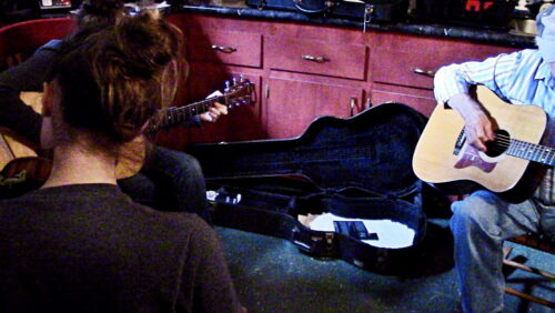 girls and Pap playing guitars