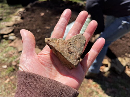 heart shaped rock in hand