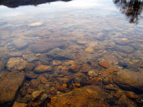 clear water with rocks on lake bed