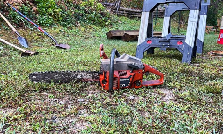 Chainsaw sitting on ground