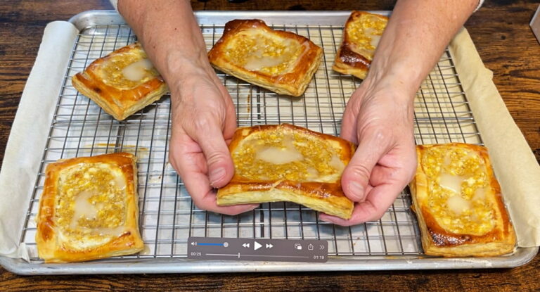 hands breaking apart danish