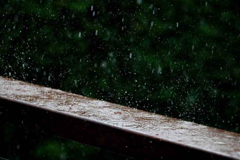 rain falling on railing