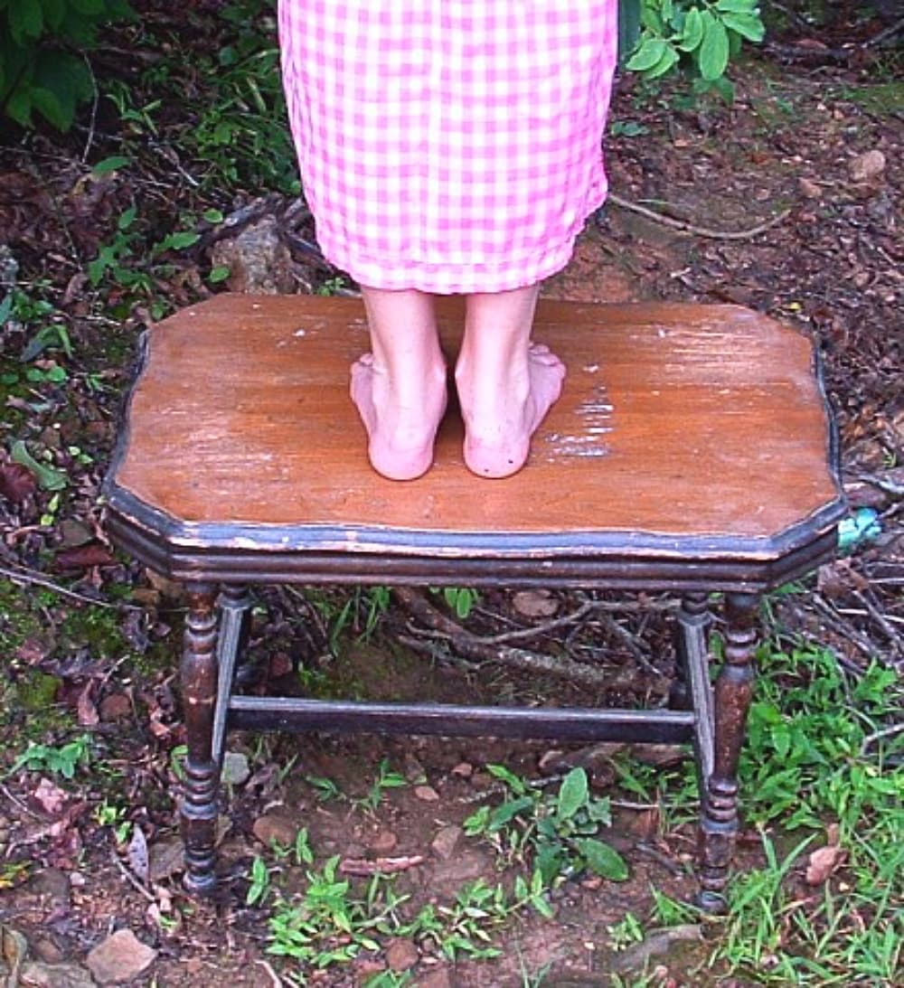 child standing on stool