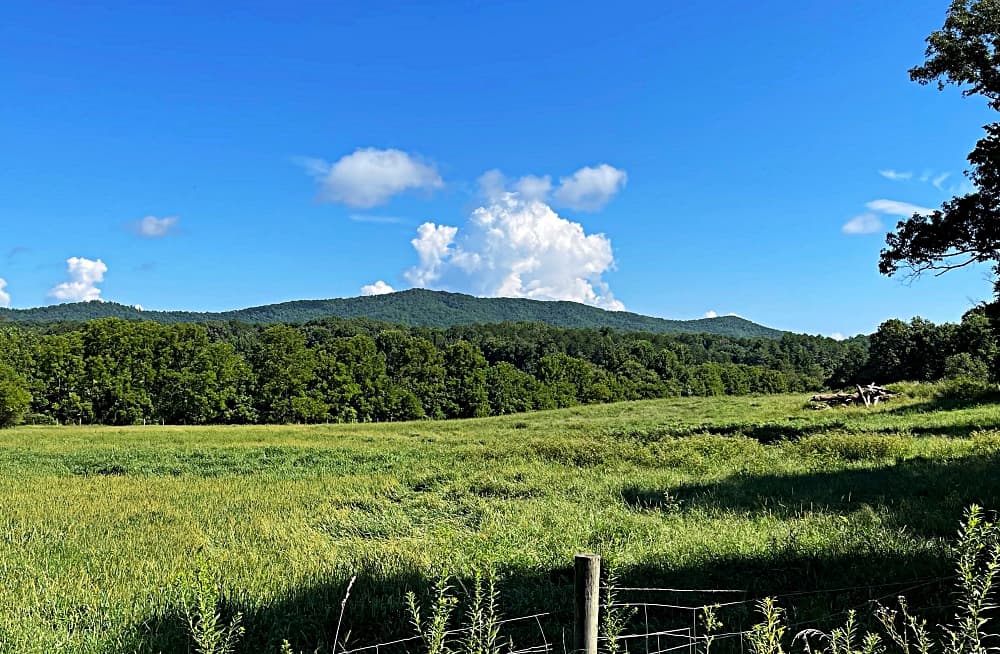 green mountains with blue sky