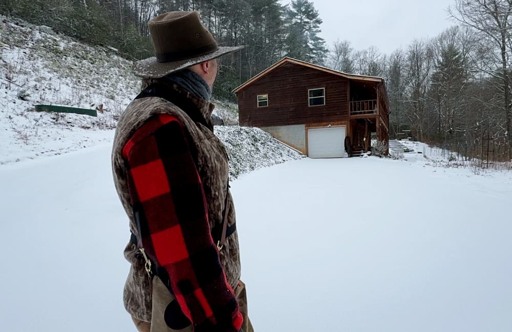 man standing in snow