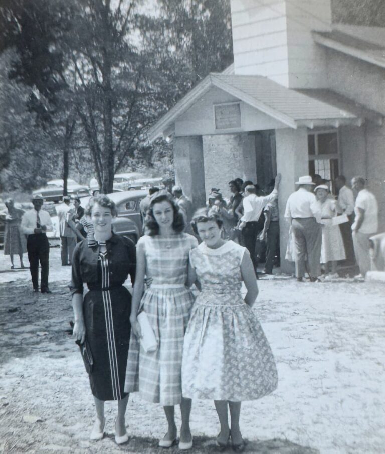 three girls in front of church in the 50s
