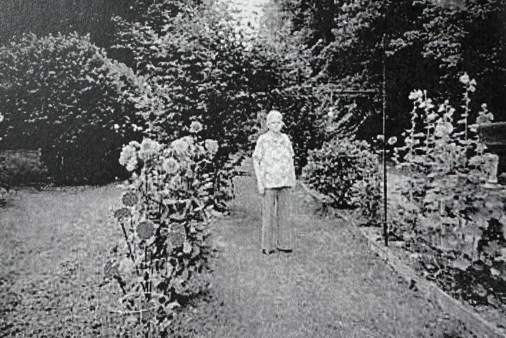 woman standing with flowers