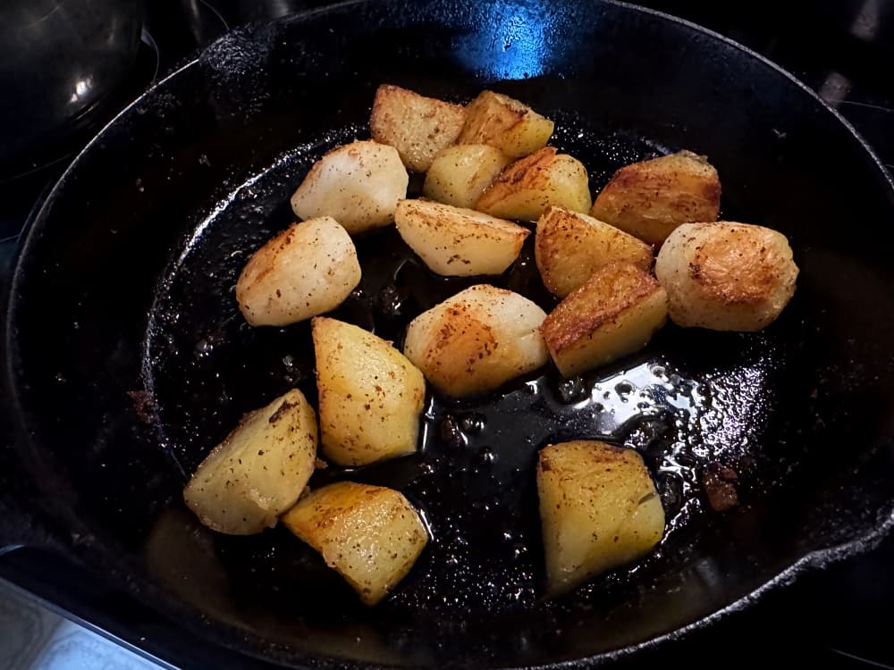 cast iron pan of potatoes