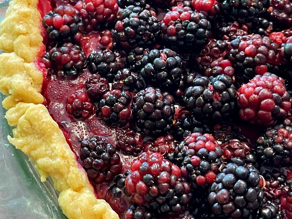 close up of crust of blackberry pie