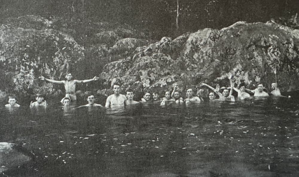 group of boys in swimming in river