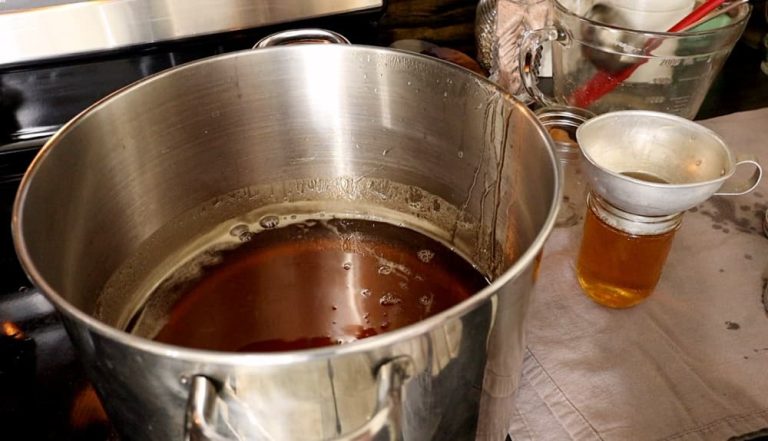 pouring jelly into jars