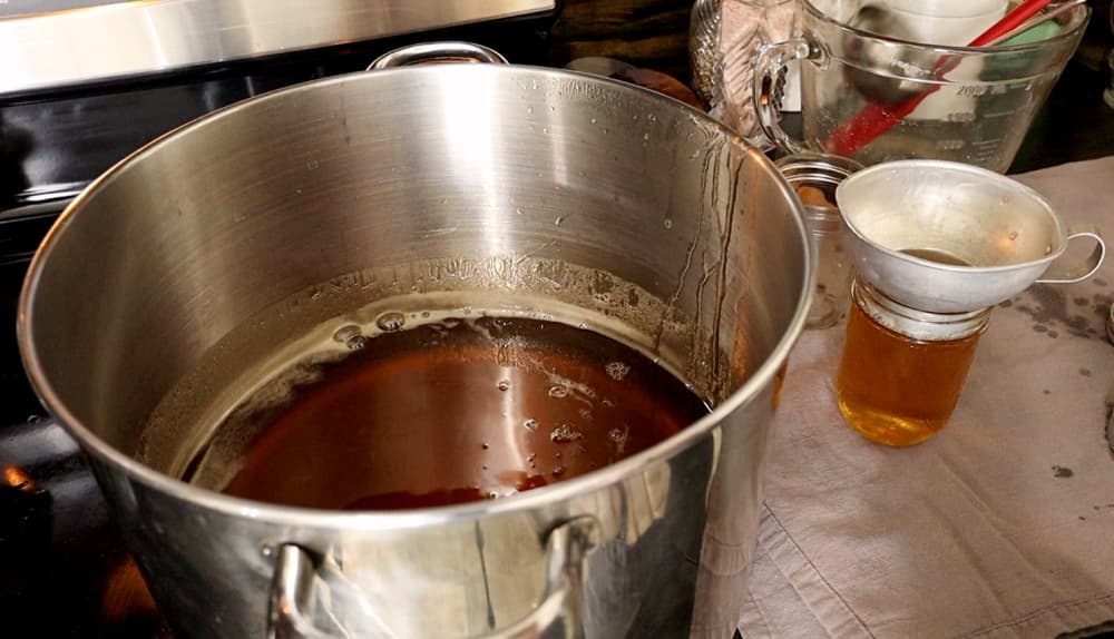 pouring jelly into jars