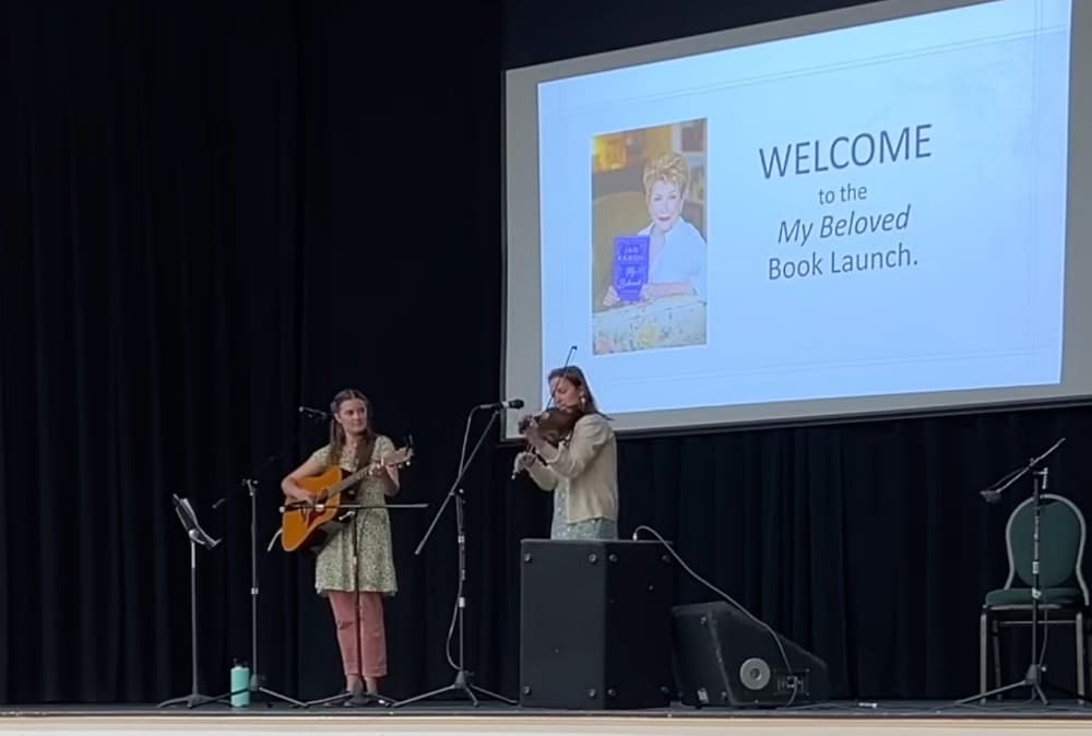 Corie and Katie on stage