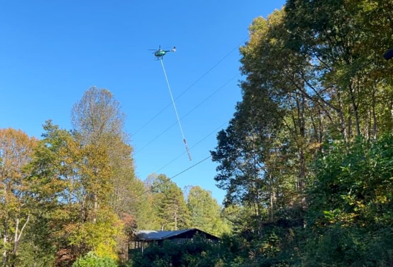 helicopter pulling giant saw