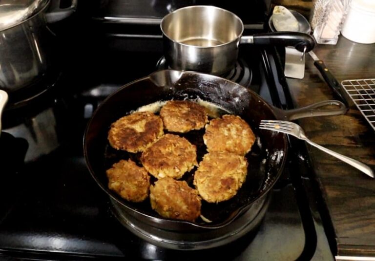 Salmon Patties frying in pan
