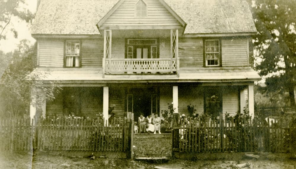 large house with people on porch
