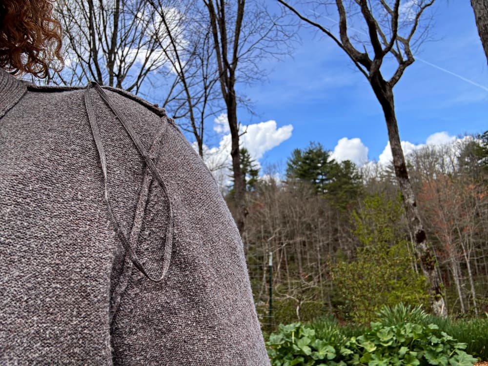 women wearing sweater inside out