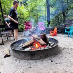 girl by campfire