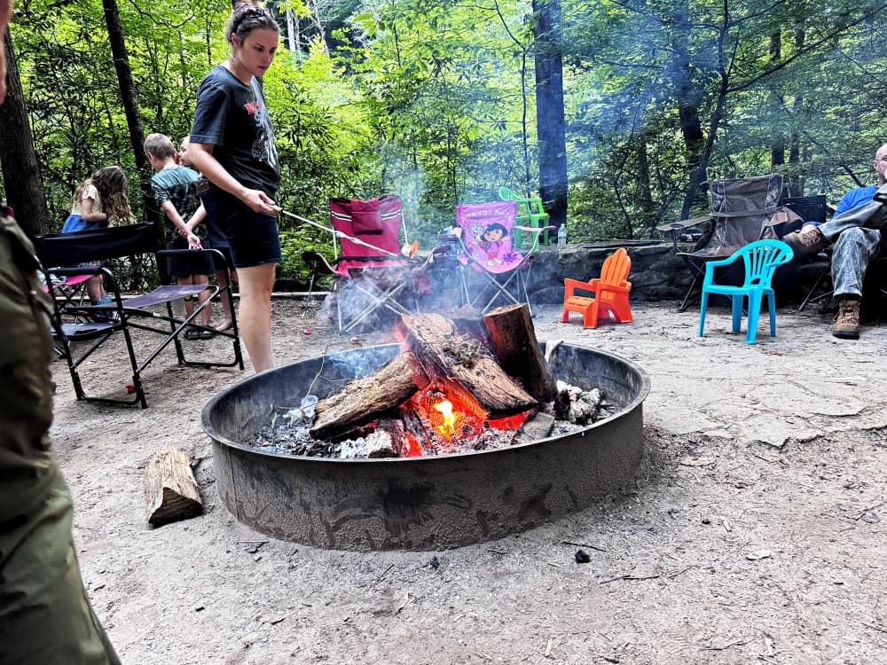 girl by campfire