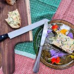 block of butter on plate with flowers